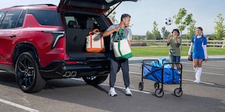 A Man Packing his Trunk with Soccer Equipment in his 2024 Chevy Traverse