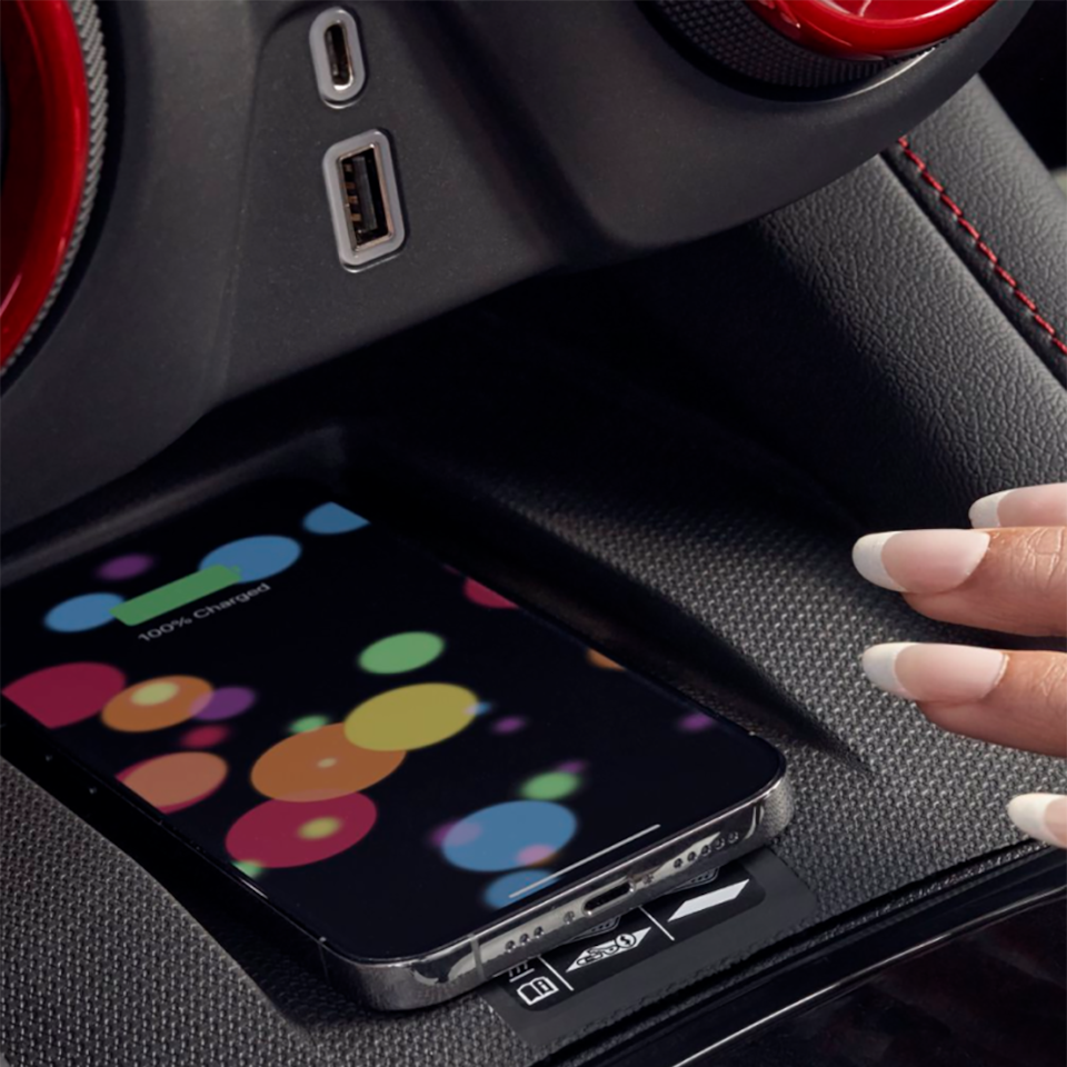 A person's smartphone stowed in a compartment inside the 2025 Chevrolet Blazer.