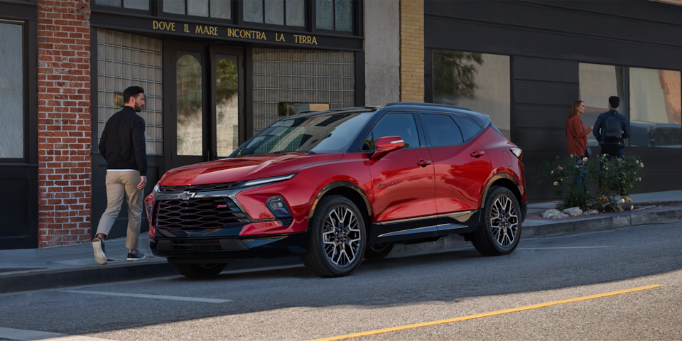 2025 Chevrolet Blazer parked beside a city building.