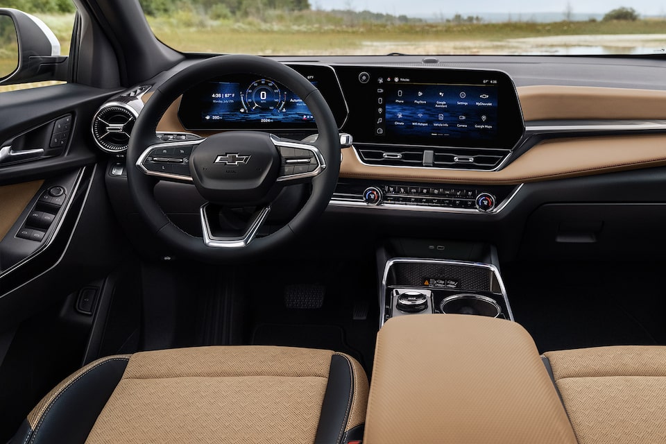 Driver's perspective of the refined interiors of the 2025 Chevrolet Equinox compact SUV.