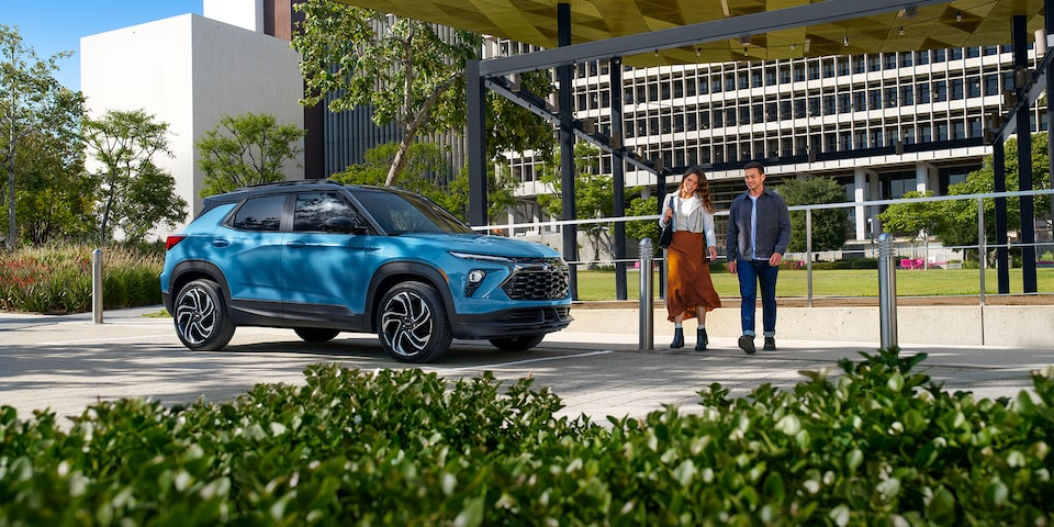 Scenic view of the 2025 Chevrolet Trailblazer by a park in the city.