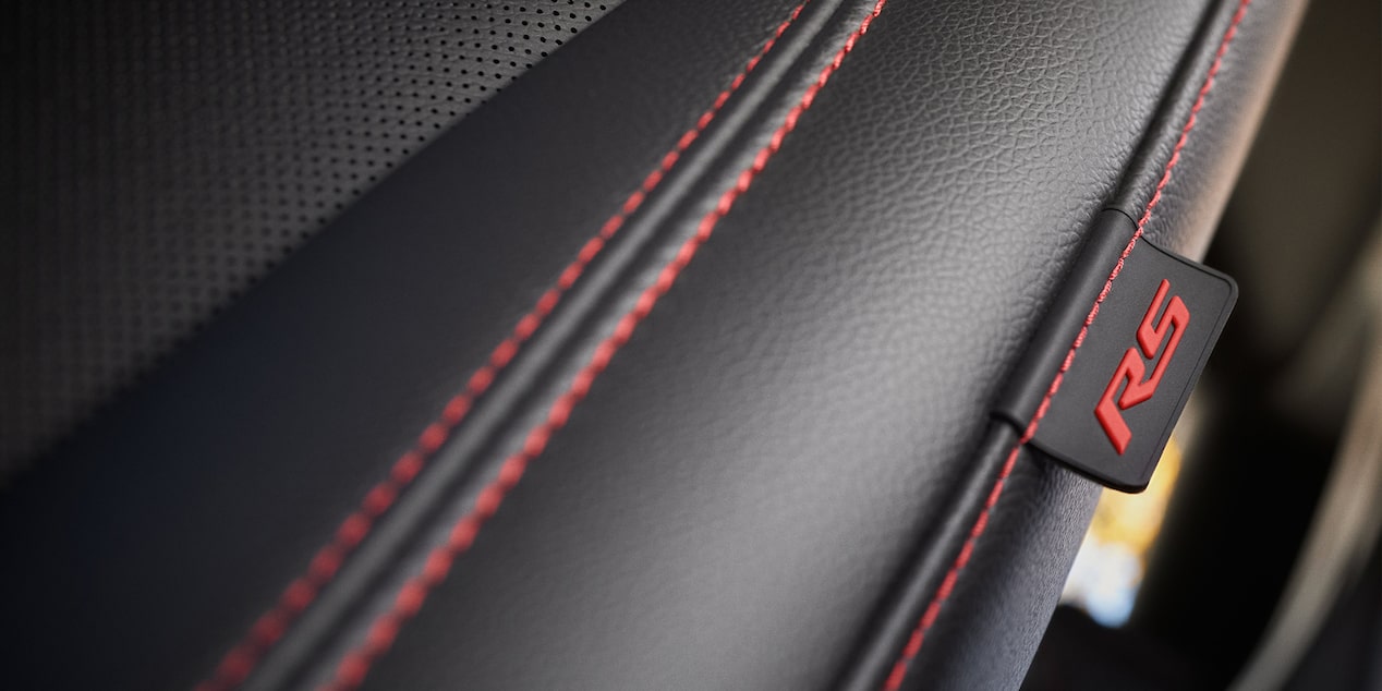 The masterfully crafted red accented stitching of the 2024 Chevrolet Equinox RS interior seating.