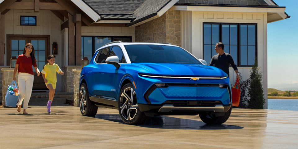 2024 Chevrolet Equinox EV parked in front of a house.