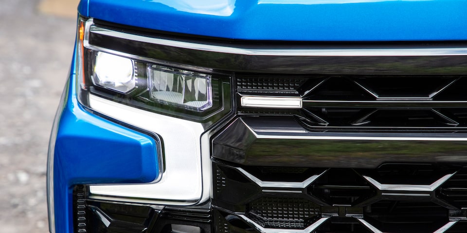 Closeup view of the headlight on the 2024 Chevrolet Silverado work truck.