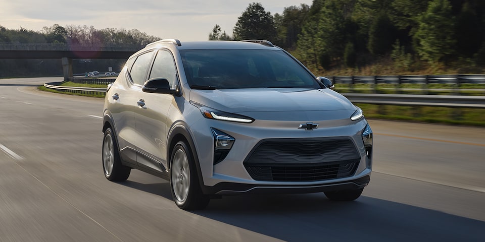 The Chevrolet Bolt driving on a road.