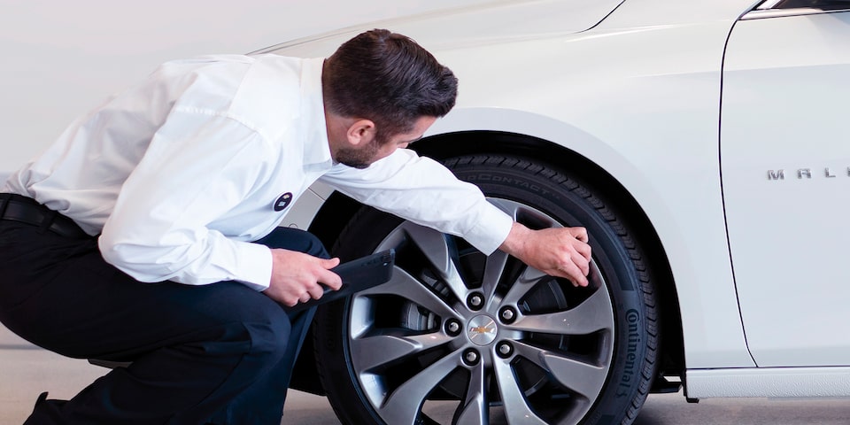 Certified Service Expert checks a vehicle.