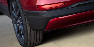 The black accented rear bumper of the 2024 Chevrolet Equinox RS.