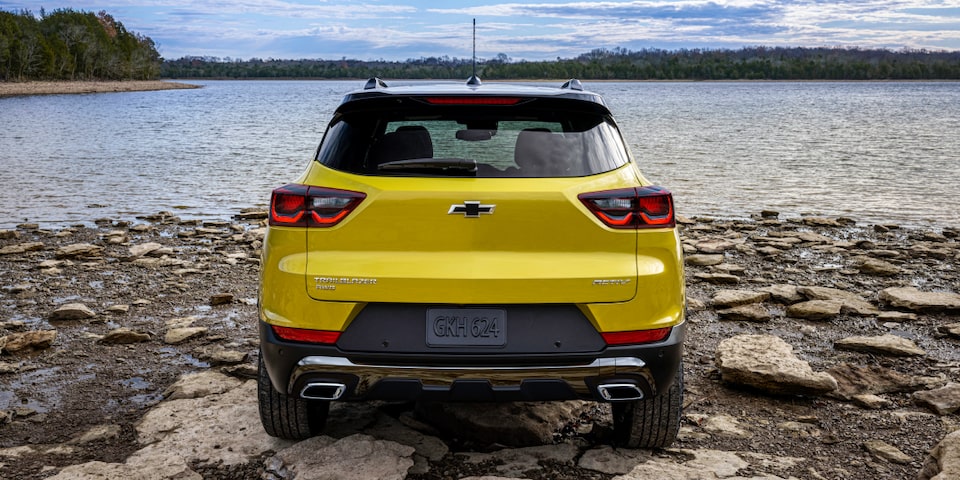 Back view of the 2024 Chevrolet Trailblazer parked by the lakeside.