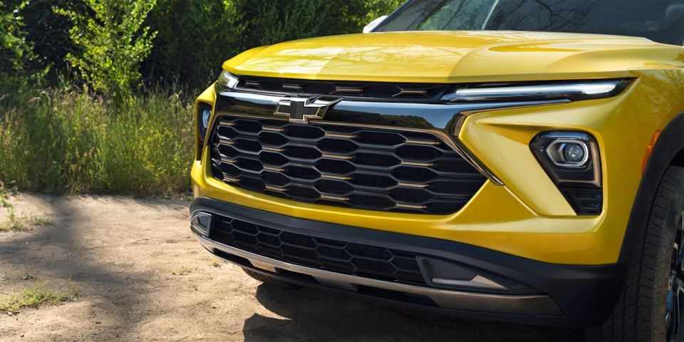 Close-up view of the black mesh grilles with dark chrome accent of the 2024 Chevrolet Trailblazer.