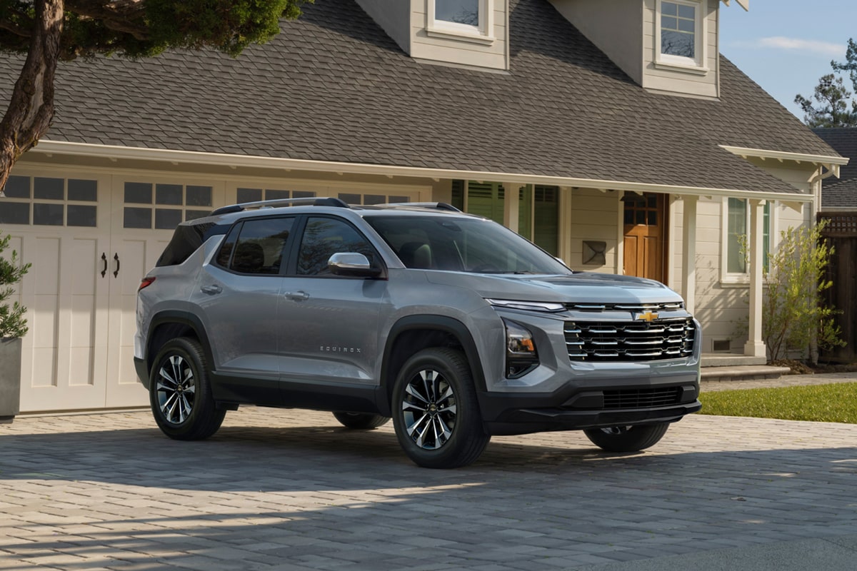 2025 Chevrolet Equinox compact SUV parked outside a house.