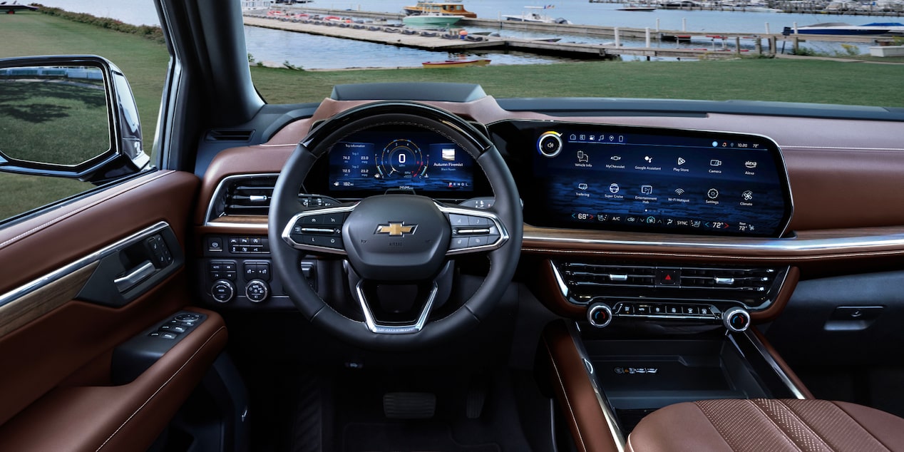 Driver's view of the spacious interiors of the 2025 Chevrolet Suburban SUV.