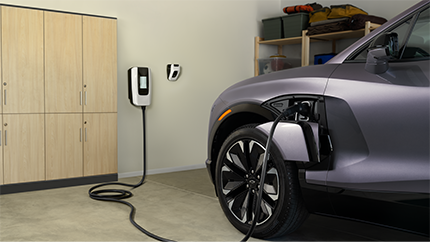 2025 Chevrolet Blazer EV recharging at a home charging port.