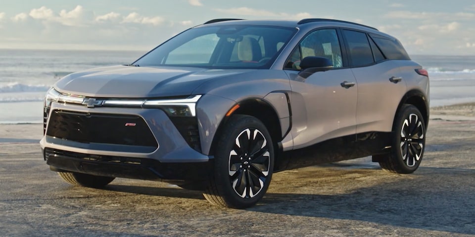 Three quarters view of a 2025 Chevrolet Blazer EV parked on a beach.