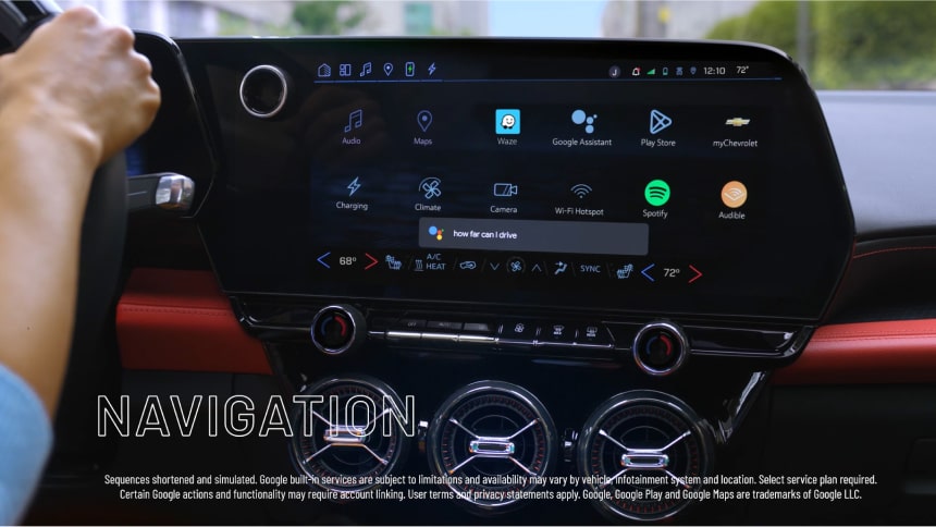 Close-up view of the infotainment screen and a hand on the steering wheel of the 2025 Chevrolet Blazer EV.