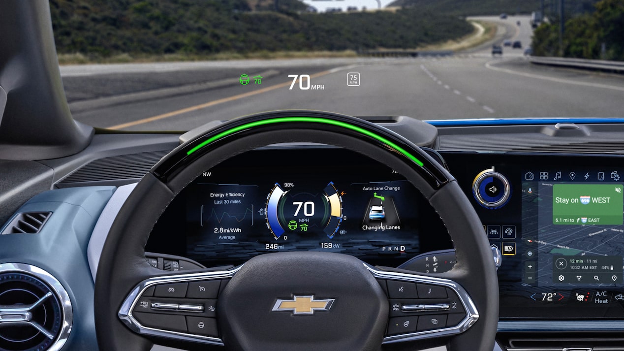 Close-up view of the steering wheel of a 2025 Chevrolet Blazer EV with a speedometer displaying 70 mph.