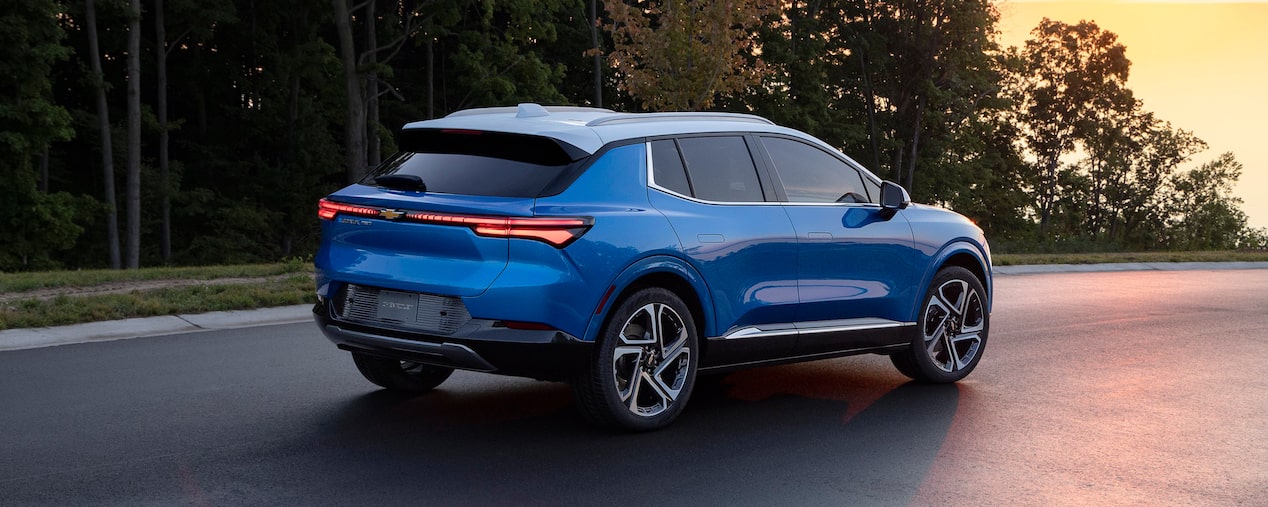 Rear View of a Chevrolet Blazer EV Driving at Sunset