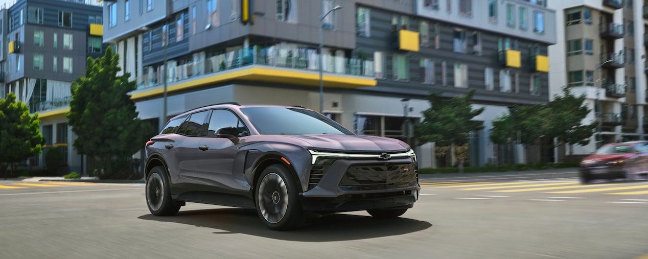 Chevrolet Blazer EV Driving Through a City Street