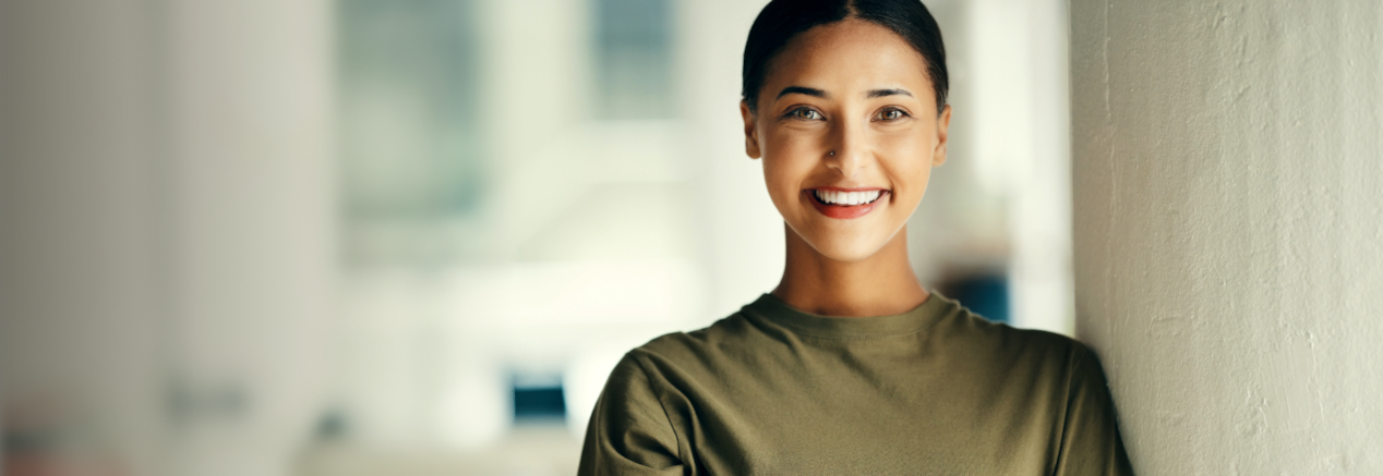 A smiling Canadian Forces personnel eligible for Chevrolet's Canadian Forces Bonus Program.