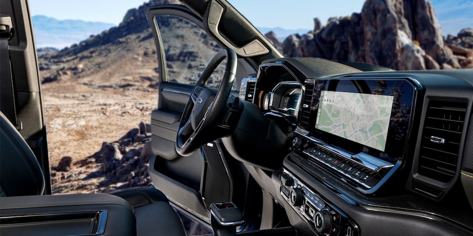 Front passenger's view of the interiors of the 2025 Chevrolet Silverado LD with its door open. 