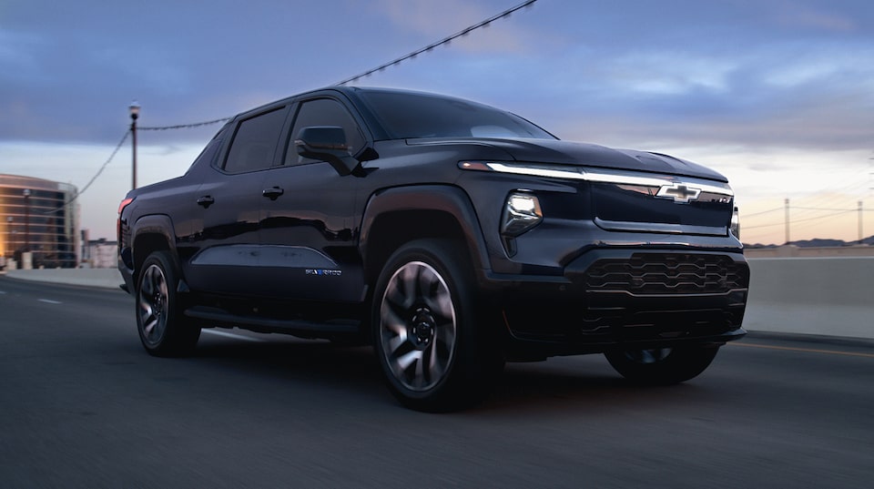 2024 Chevrolet Silverado EV driving in the city.