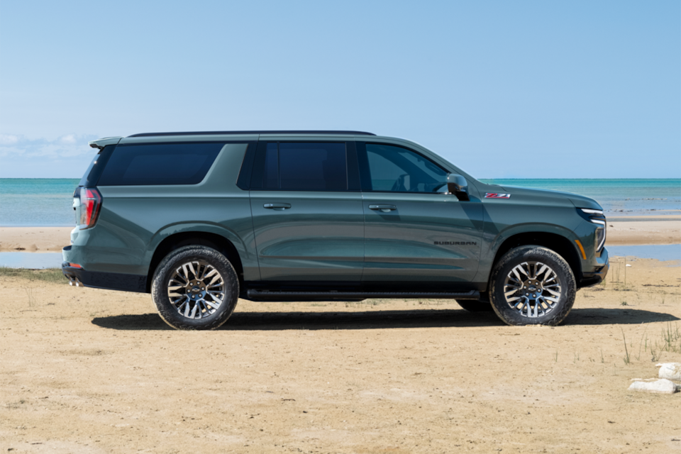 Side View of the 2025 Chevrolet Suburban SUV Parked Near a Lake