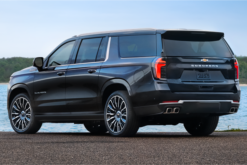 Partial side view of the New 2025 Chevrolet Suburban by a waterfront.