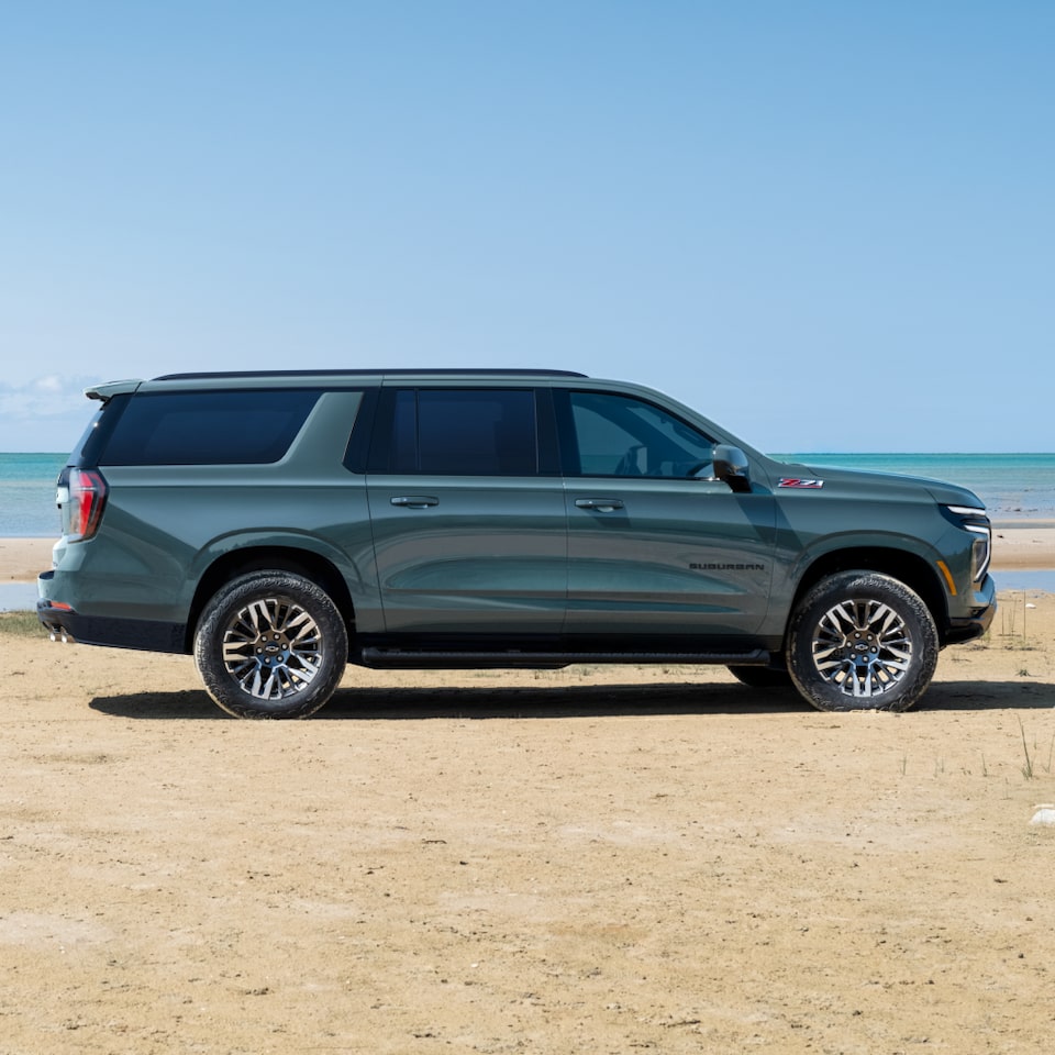 Side View of the 2025 Chevrolet Suburban SUV Parked Near a Lake