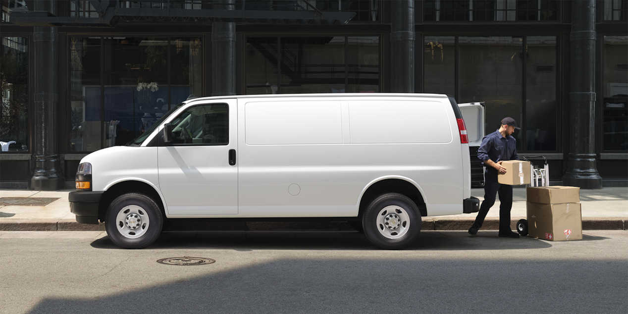 Man Unloading Boxes From His 2025 Chevy Express Cargo Van